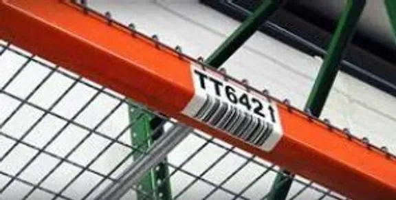 A close up of the bar code on a metal rack.